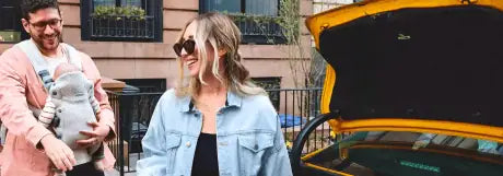 BabyBjorn Baby Carrier with parents travelling on a holiday